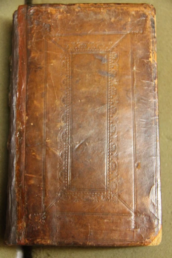 an old leather book with a faded edge