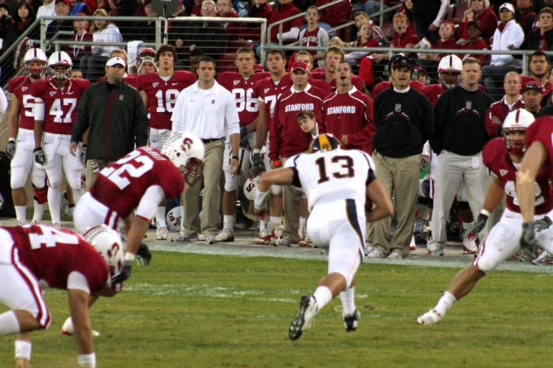 a team playing football in front of fans