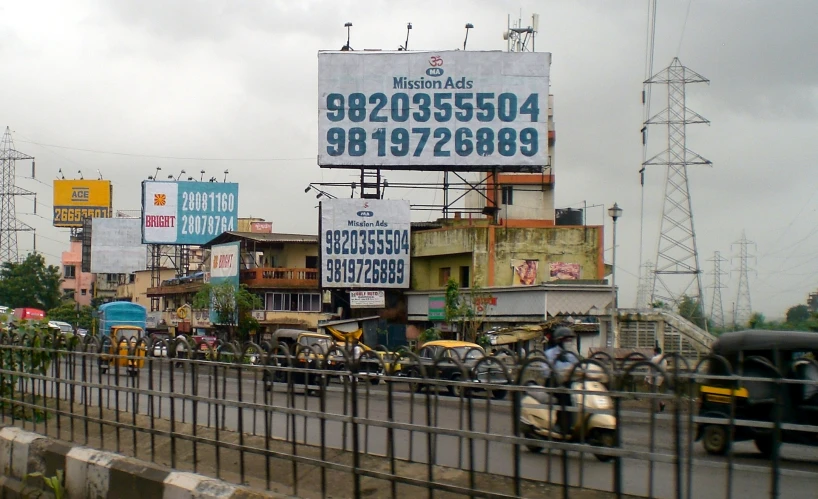 a large billboard on the side of a city street