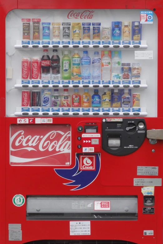 a coca cola machine filled with sodas, cans, and pepsi