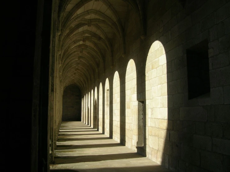 a row of arched windows on the side of a wall