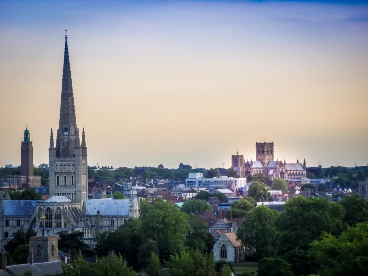 the city with many steeples stands in a sunset view