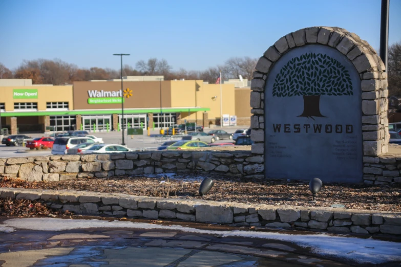 a tree is on the sign outside a building