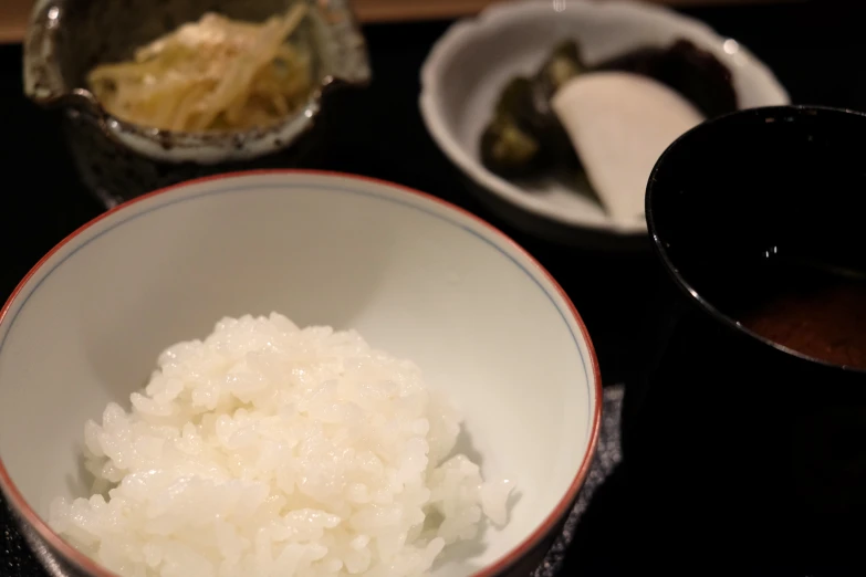 rice and other foods are on a tray