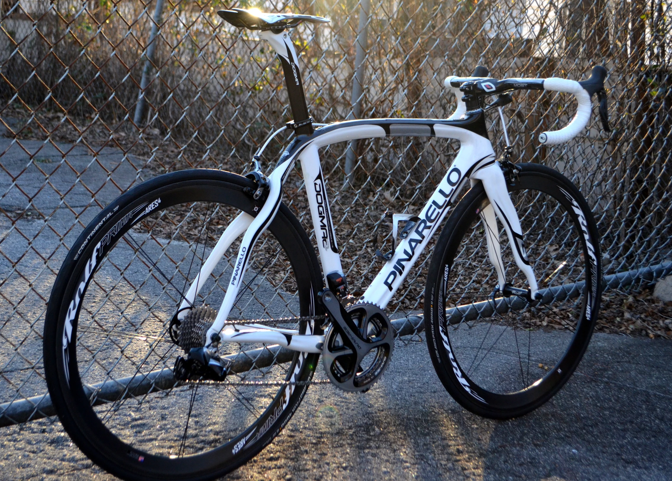 an image of a bicycle that is parked by some fence