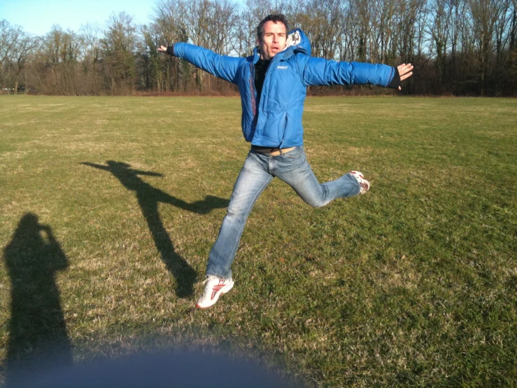 a man jumping in the air on a sunny day