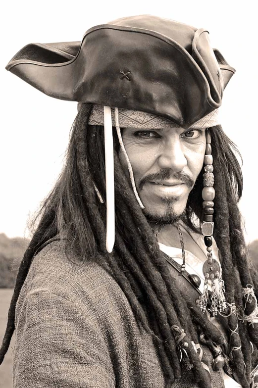 man with dreads in black and white pograph