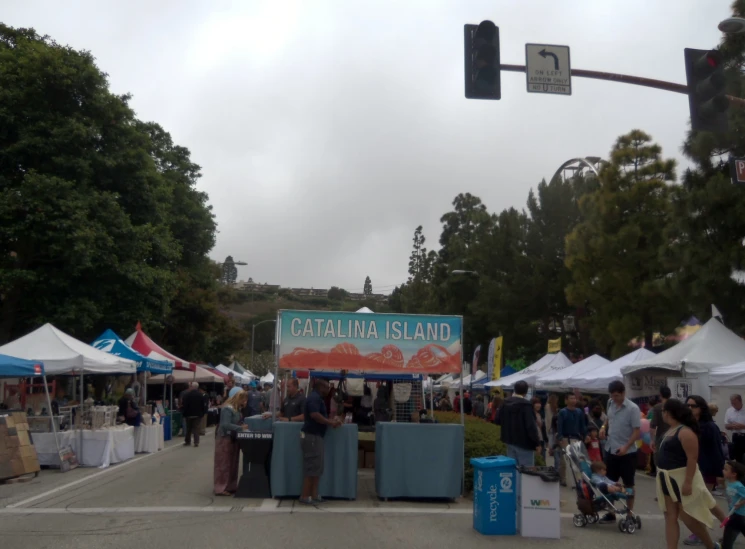 several tents, including the sign for castro de castros island are set up on a city street