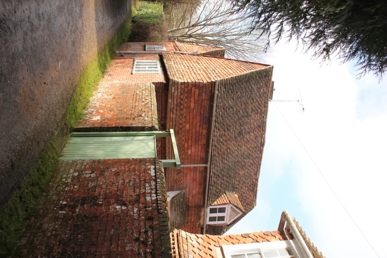 a red brick building with two windows and some doors