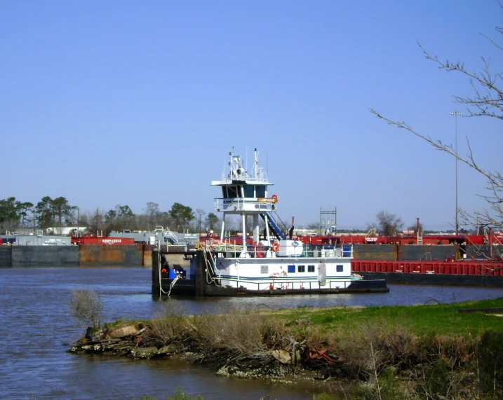 two tug boats that are moored in the water