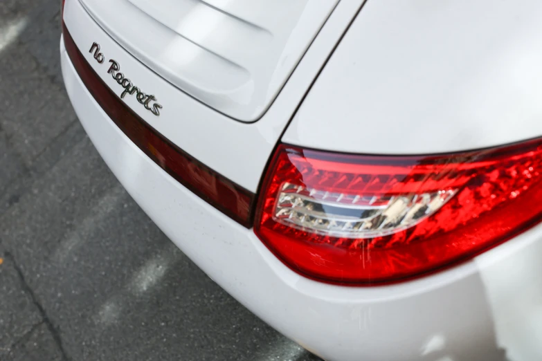 a white car parked on the side of a road