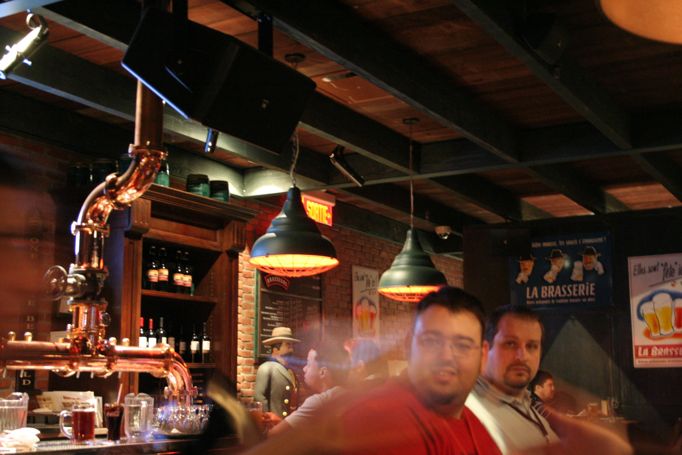 a man at the bar making a goofy face for the camera