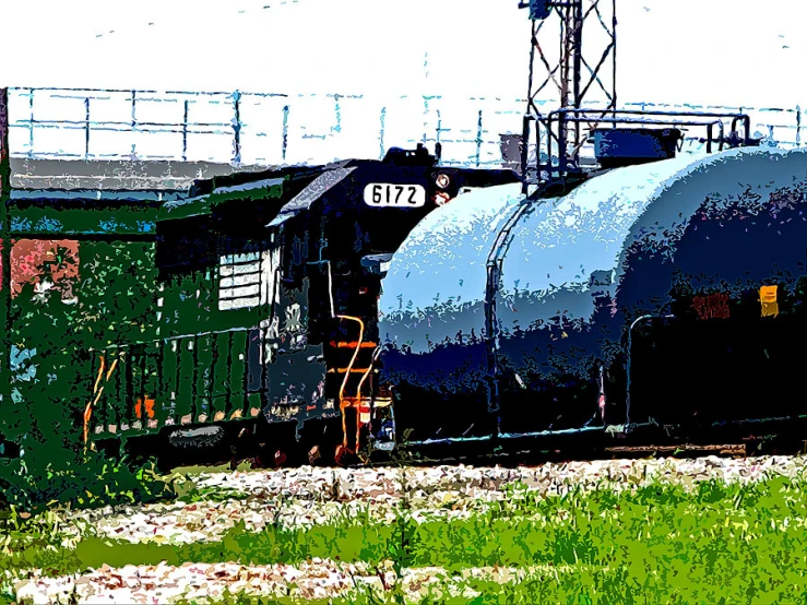 train on the tracks running beside a grassy area