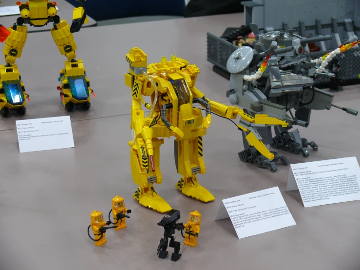 yellow and black robots are on a table