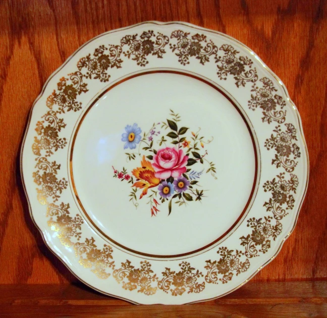 a fancy plate has some different flowers on it