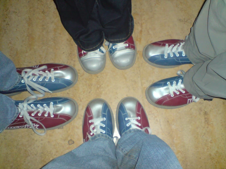 several people wearing red and blue tennis shoes