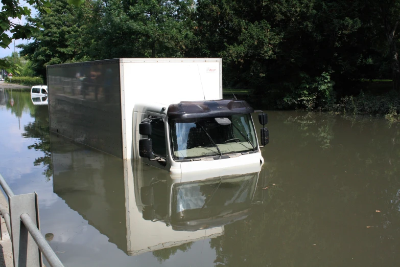 a truck that is sitting in the water