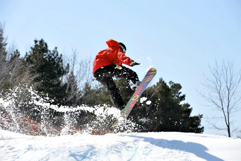 a snowboarder does a trick in the air