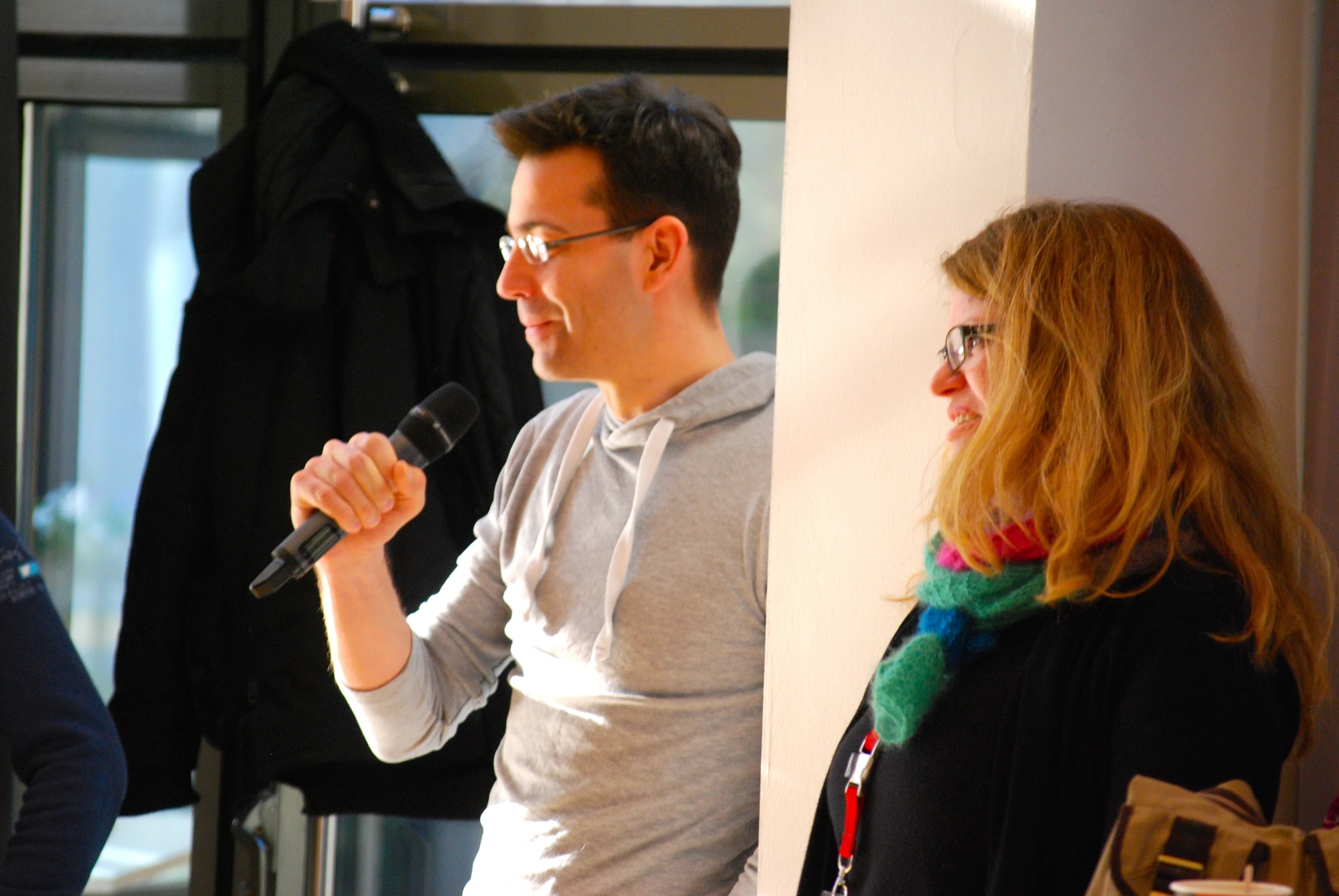 a woman with red hair holding a microphone