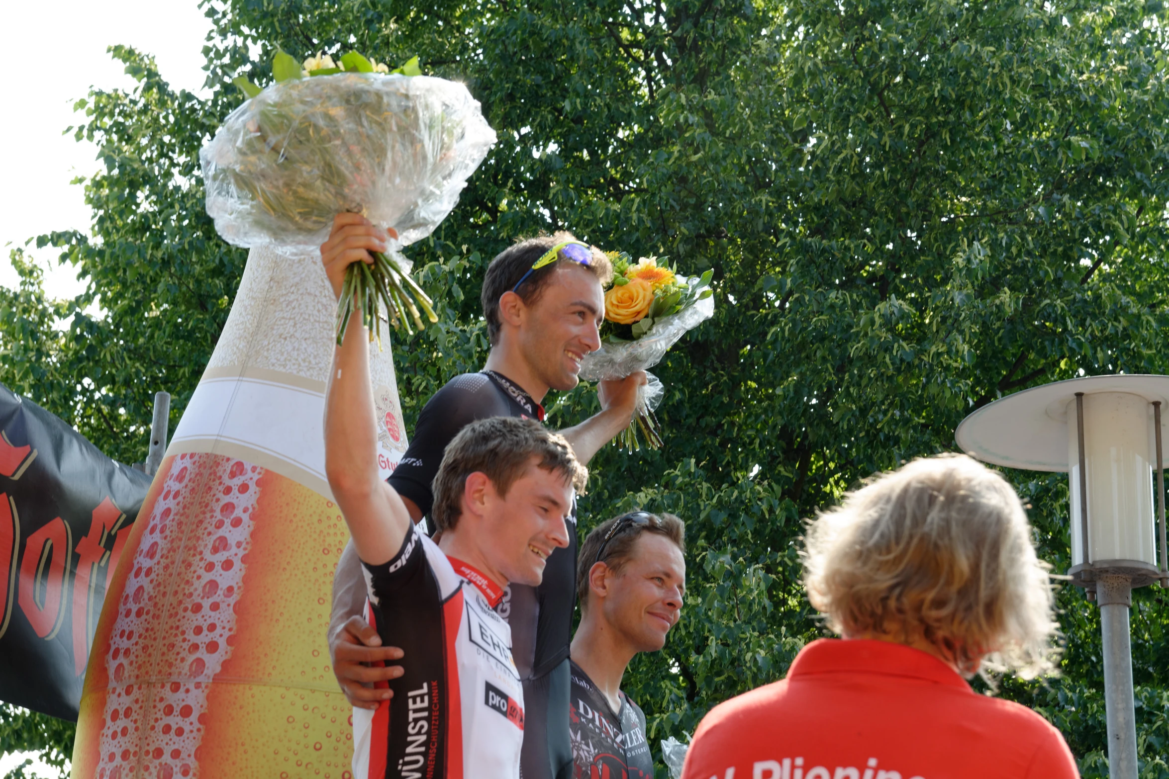 a woman with flower bouquets is walking with a man