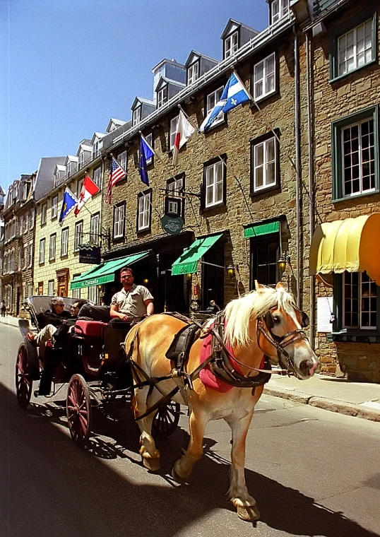 there are people that are riding in the back of a carriage