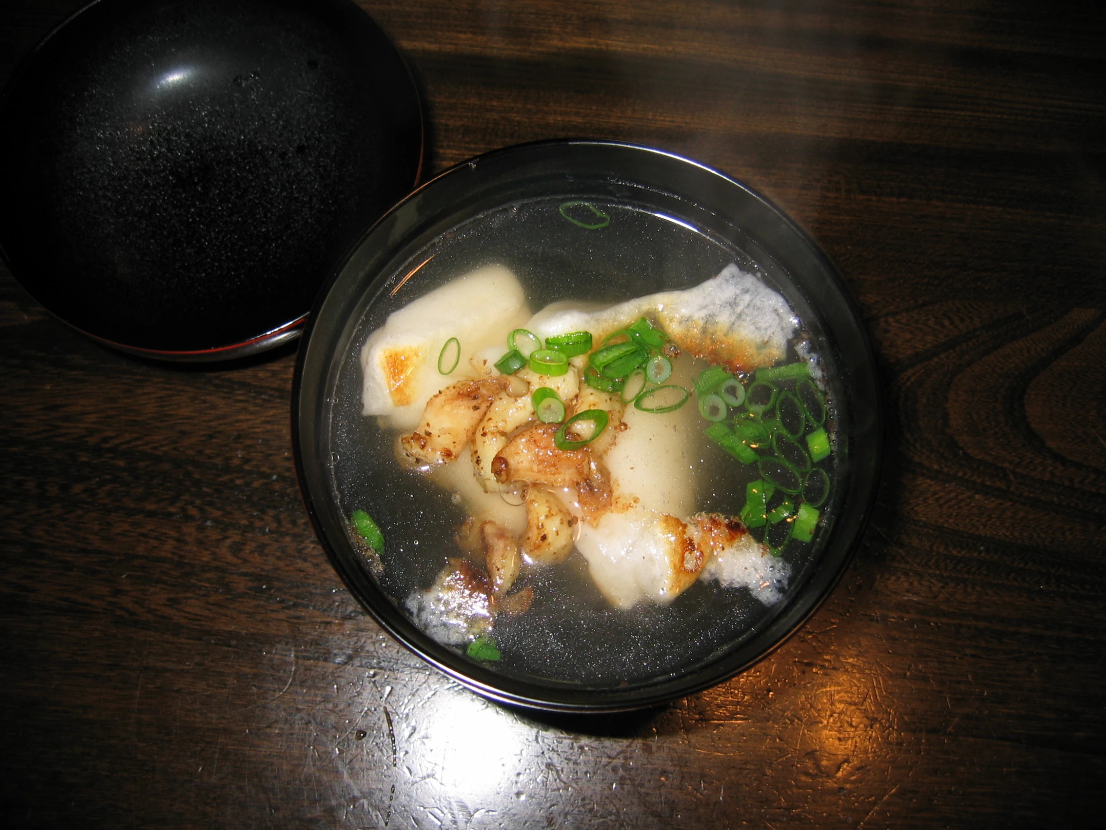 some food sitting on top of a bowl on a table