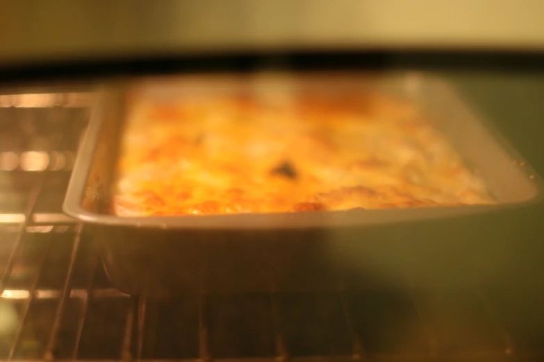 a close up of a baking dish in the oven