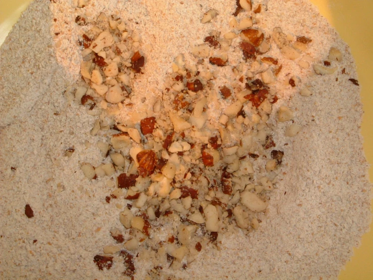 a yellow plate filled with various ingredients for bread