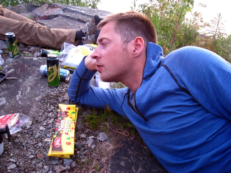 two men on the ground next to food