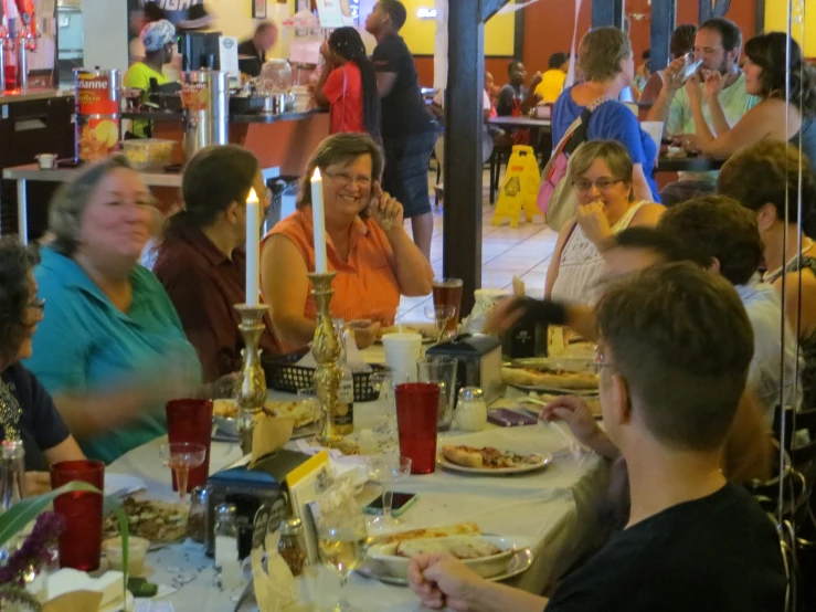 a group of people that are sitting around a table