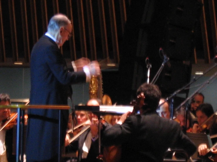 a conductor teaching a band to play