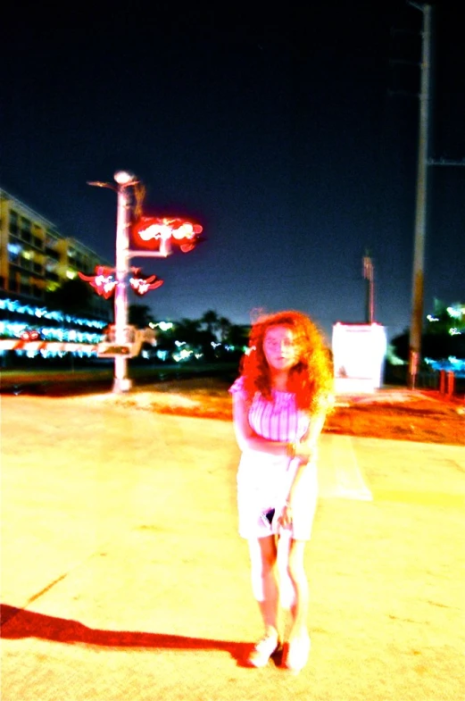 a woman holding an umbrella on the sidewalk