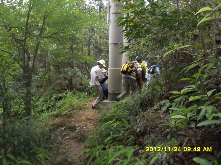 a bunch of people with some backpacks on a trail