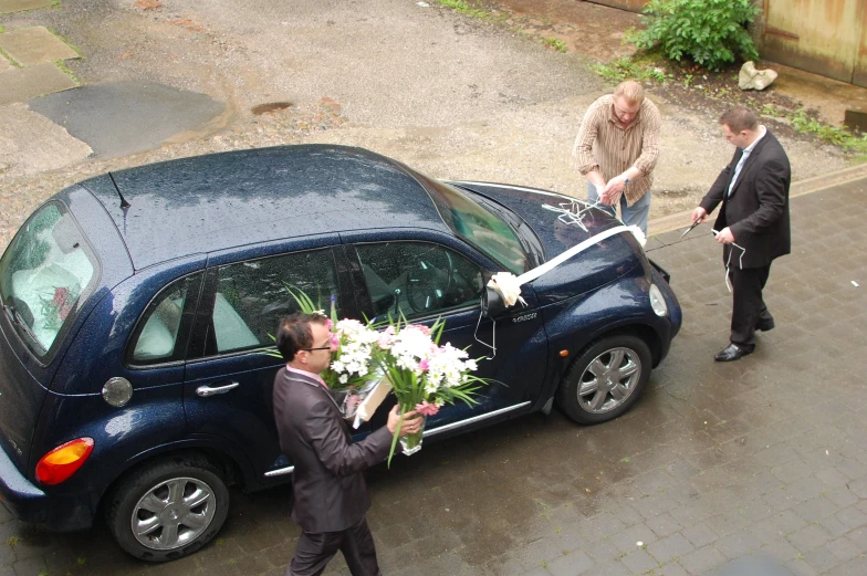 an image of people getting in to a car