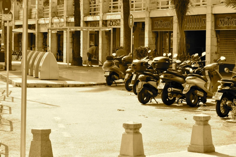 the motor cycles are lined up on the road