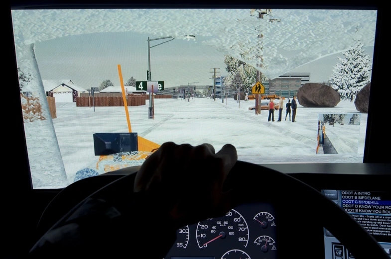 someone is riding in a vehicle on a snowy road