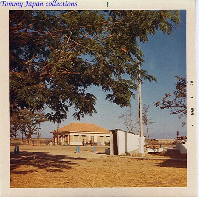 an old po of a home with a flag in the background