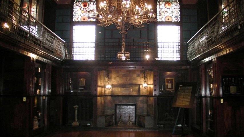 the chandelier hangs from the ceiling in an ornate room