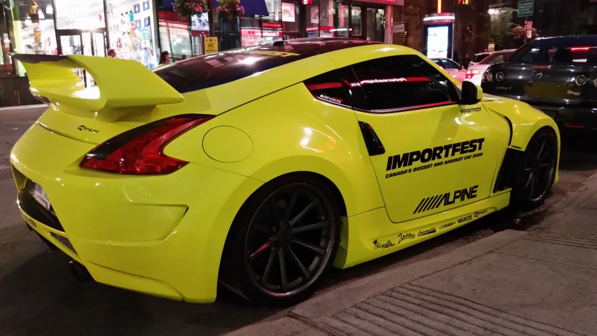 yellow sports car parked on a busy street corner