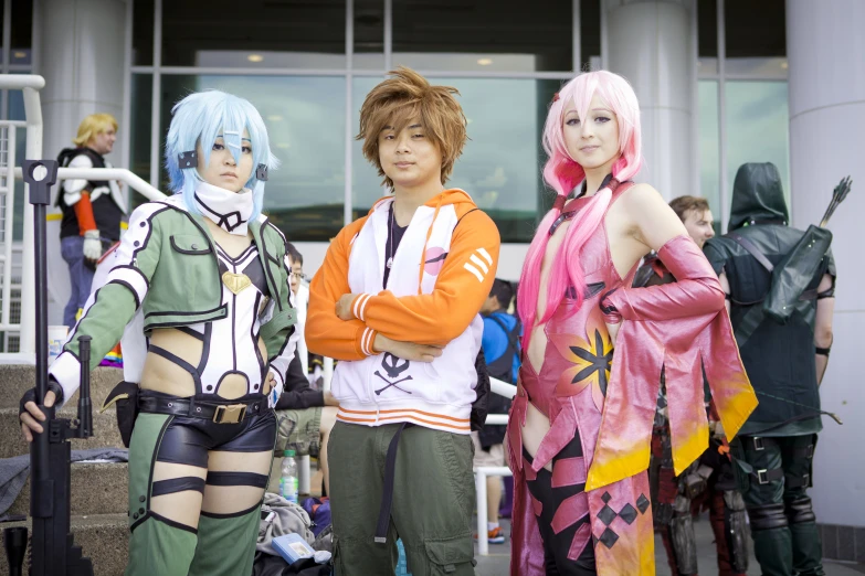 four characters standing in costumes outside of a building