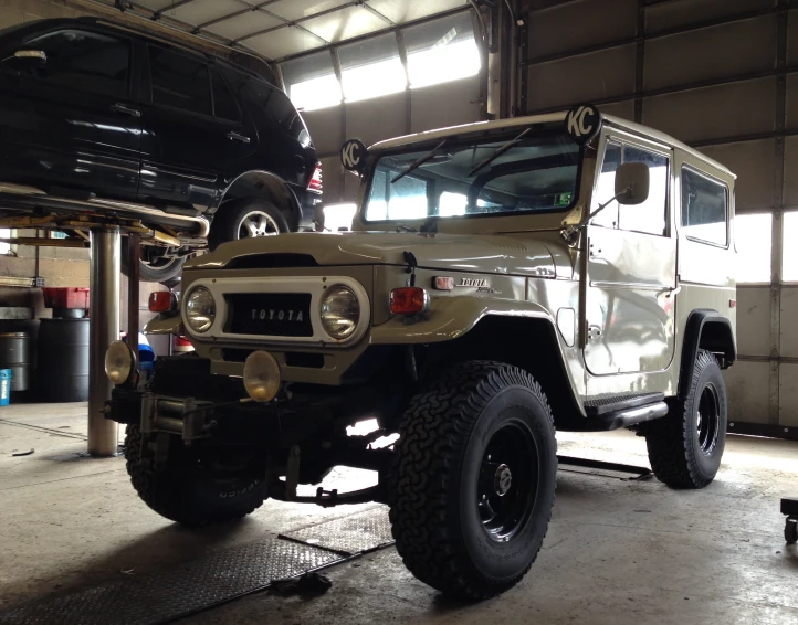 a jeep that is sitting in a garage