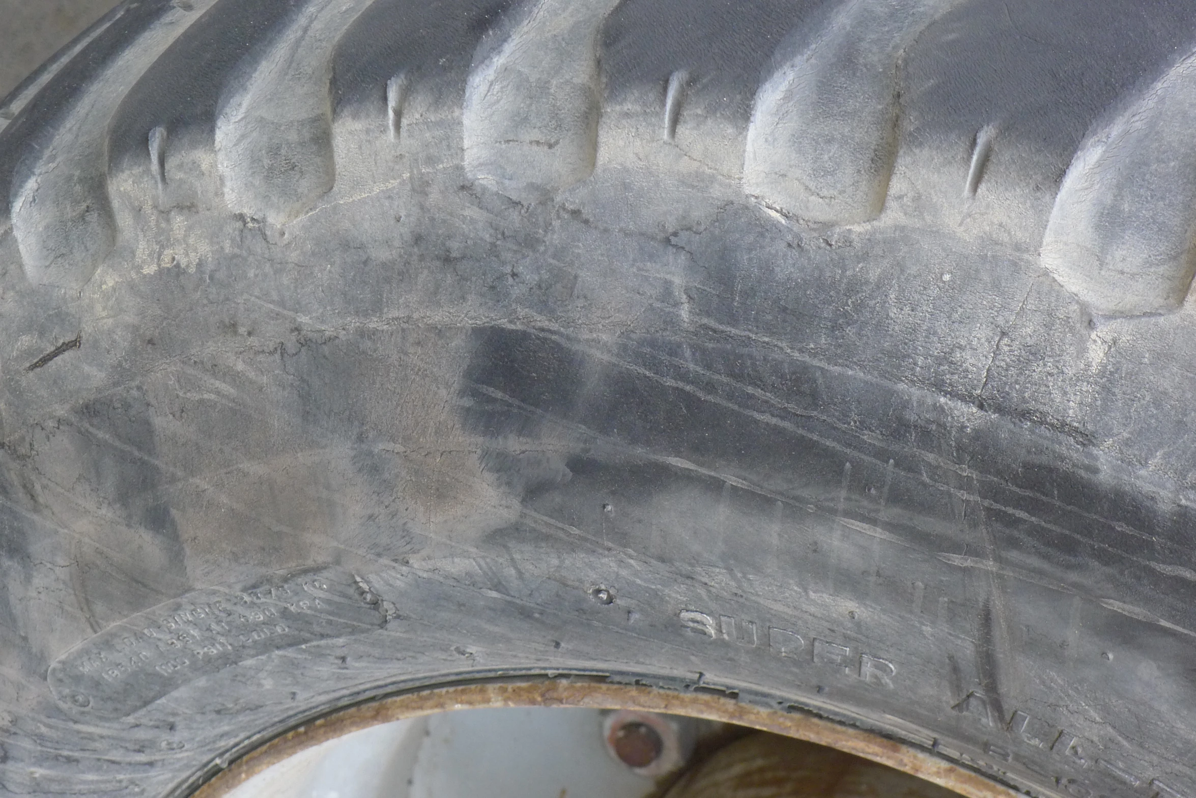 a wheel has been left on with the tire treads and there is a small patch that shows off