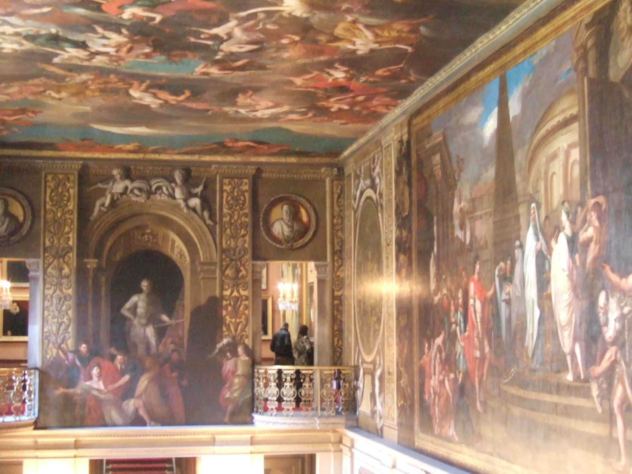 a painted wall with paintings in a room