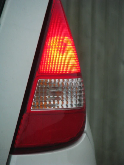 the taillight on a white car is red