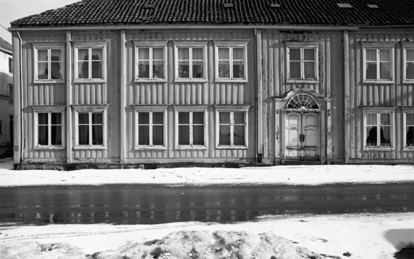 an old building that has been partially covered by snow