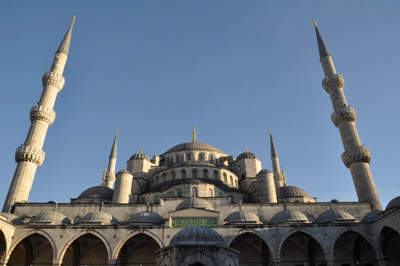 an ornate building with several minalis in front