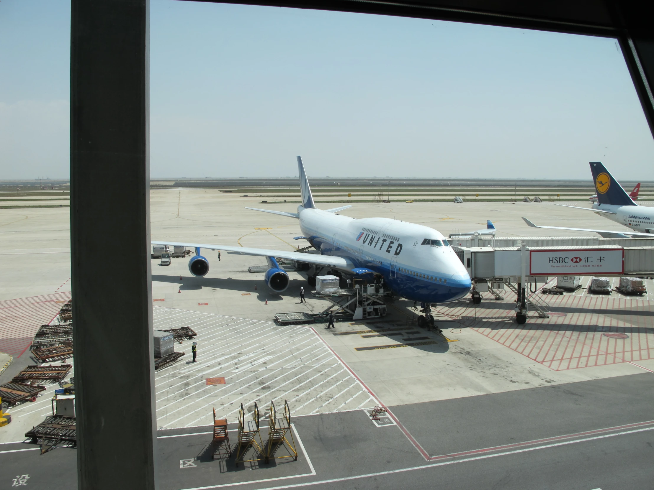 an airplane is docked on the tarmac at an airport