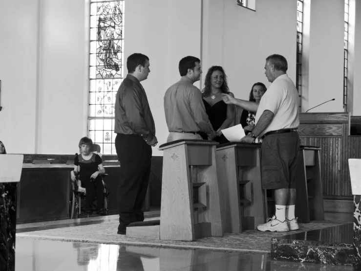 a black and white po of people in a church