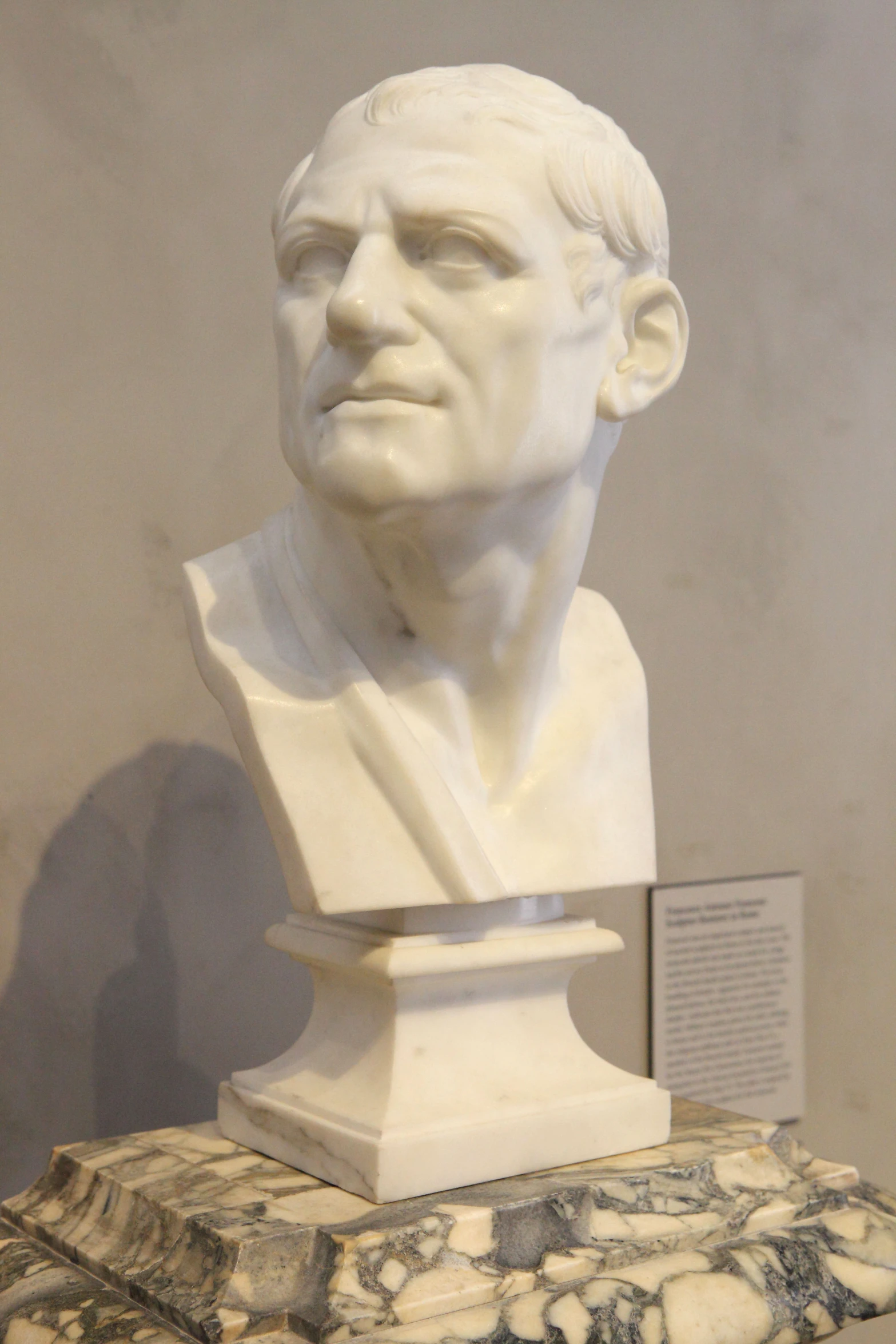 there is a bust of aham lincoln next to some sculptures
