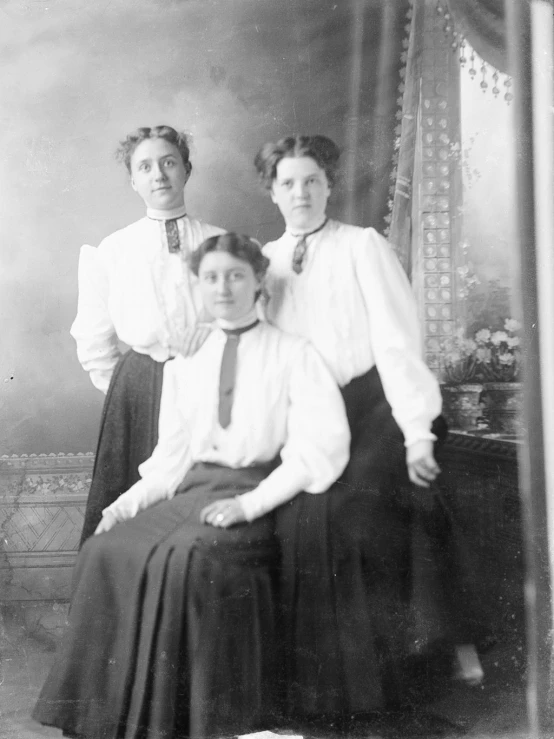 three women sitting next to each other in a po